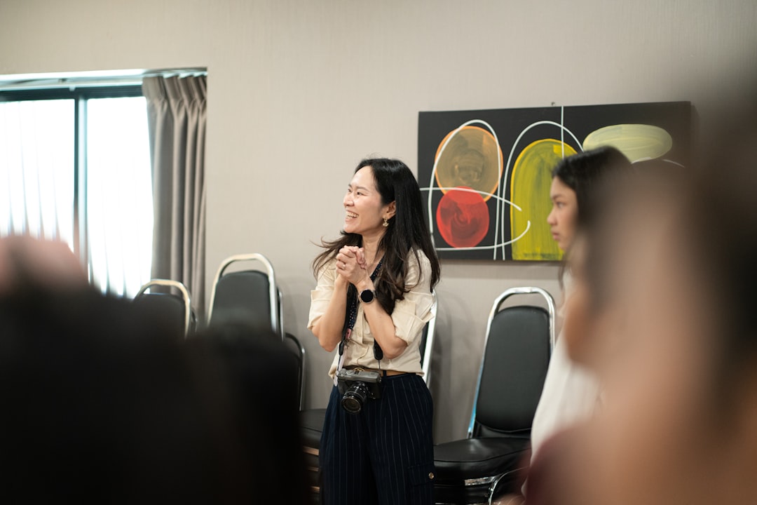 Close-up of multiple hands clapping in unison, showing appreciation from an audience at an event or performance.