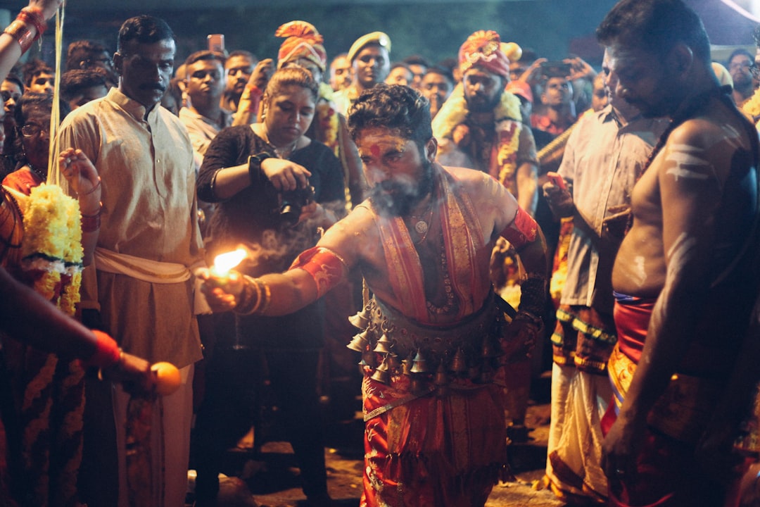 People from different cultures performing various greeting rituals like handshakes, bows, Namaste, and hongi, symbolizing human connection and cultural exchange.