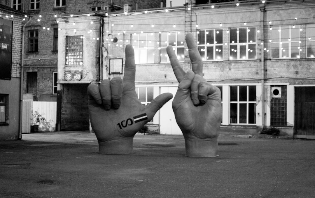 A hand giving a thumbs-up gesture, symbolizing its varying cultural interpretations and potential for misunderstanding around the world.