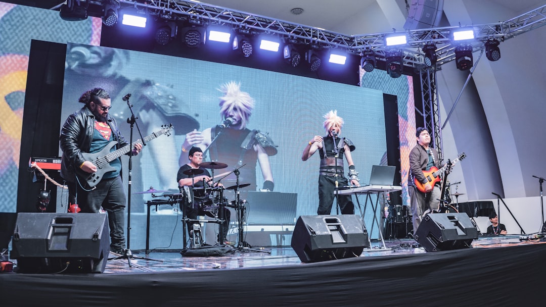 A vibrant crowd of fans at a large outdoor concert, with colorful lights and confetti, holding up friendship bracelets and phones, cheering for a pop star on stage.