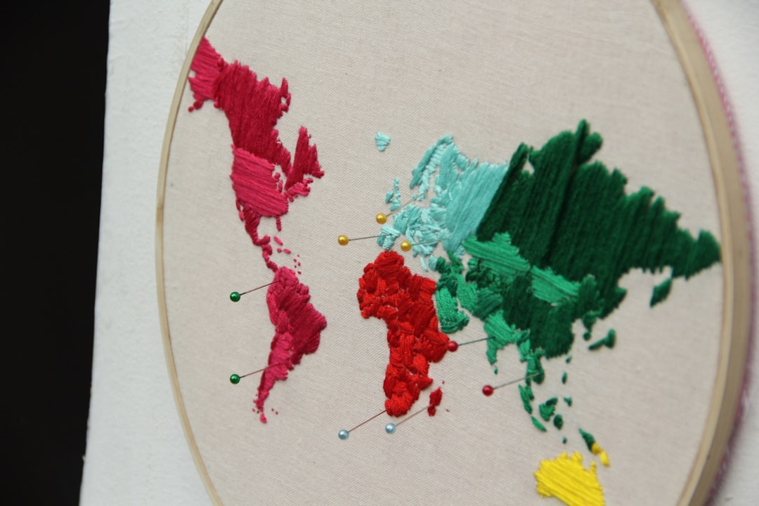 A mosaic or collage depicting hands from various cultures interacting with different colors, illustrating the diverse meanings and interpretations of colors across the globe.