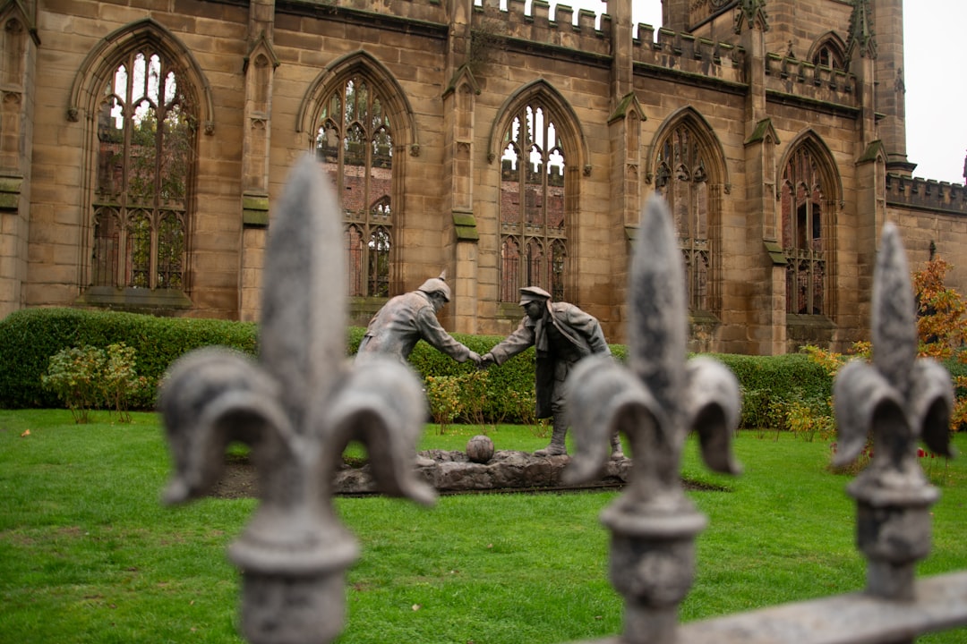 A diverse group of people shaking hands in a meeting, symbolizing connection and agreement.