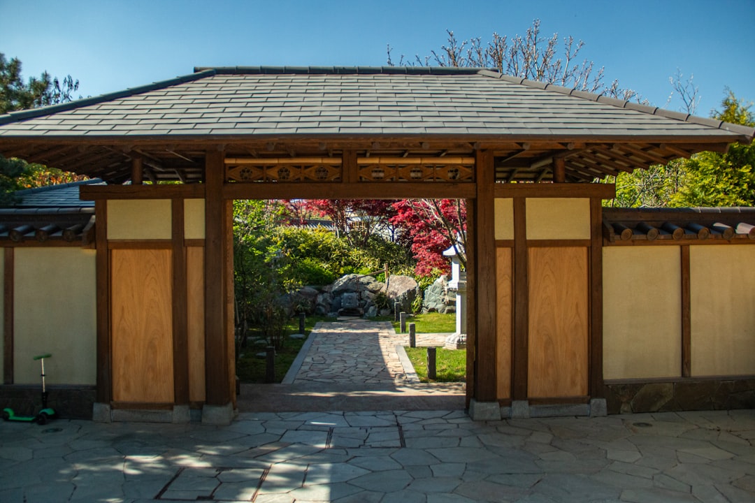 Neatly arranged shoes at a traditional Japanese genkan entrance, signifying respect and cleanliness upon entering a home.