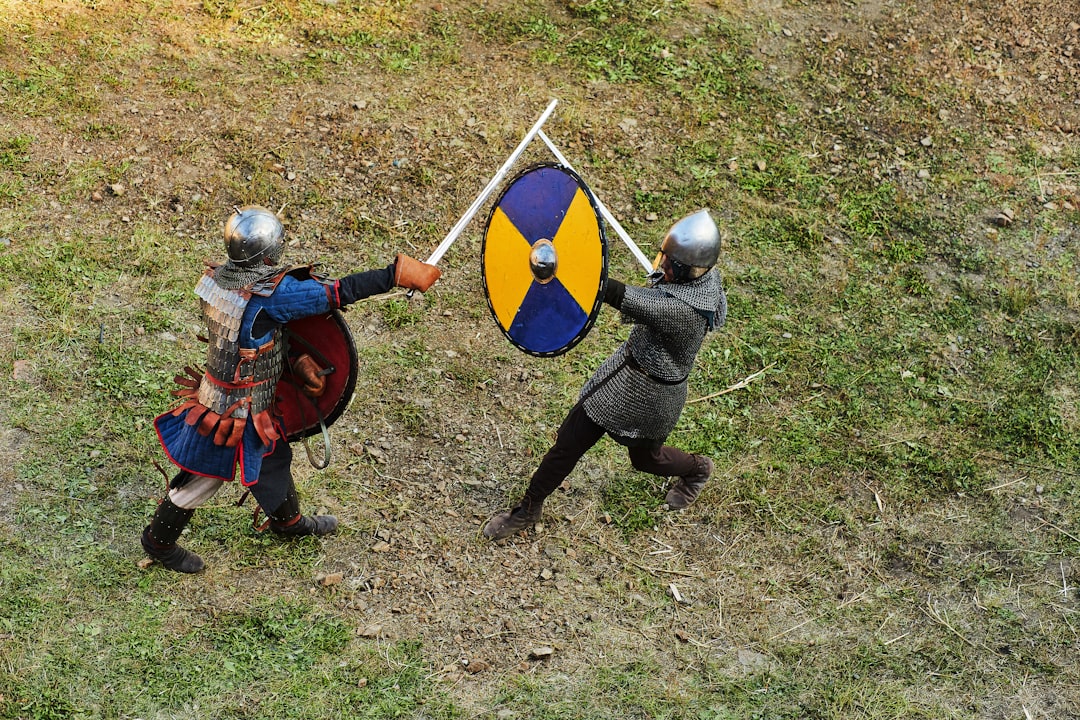 A depiction of a judicial combat for divorce in medieval Germany, showing a man in a pit and a woman with a weighted cloth weapon.