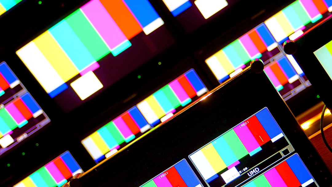 A vintage television screen transitioning from black and white to color, symbolizing the strategic introduction of color broadcasting.