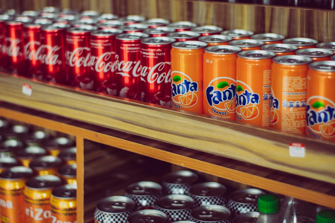 Image depicting the historical development of Fanta soda, from its origins in WWII Germany to its modern Italian orange flavor.