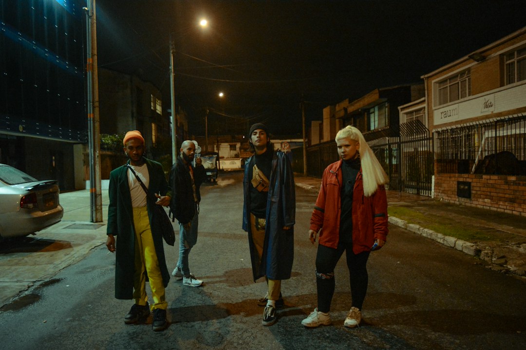 A powerful scene from The Blaze's 'Territory' music video, showing Algerian men embracing emotionally in a street setting, reflecting themes of homecoming and masculine expression.