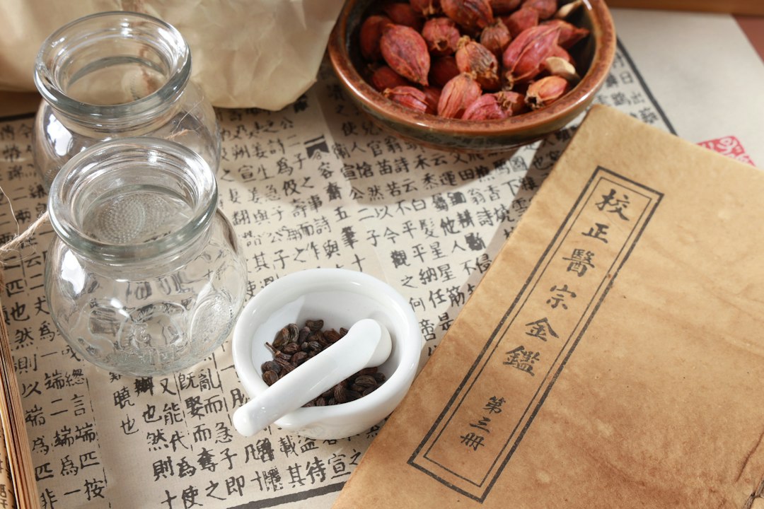 Ancient Chinese alchemists in a laboratory, unknowingly discovering gunpowder while seeking an elixir of immortality, surrounded by traditional Chinese alchemical apparatus.